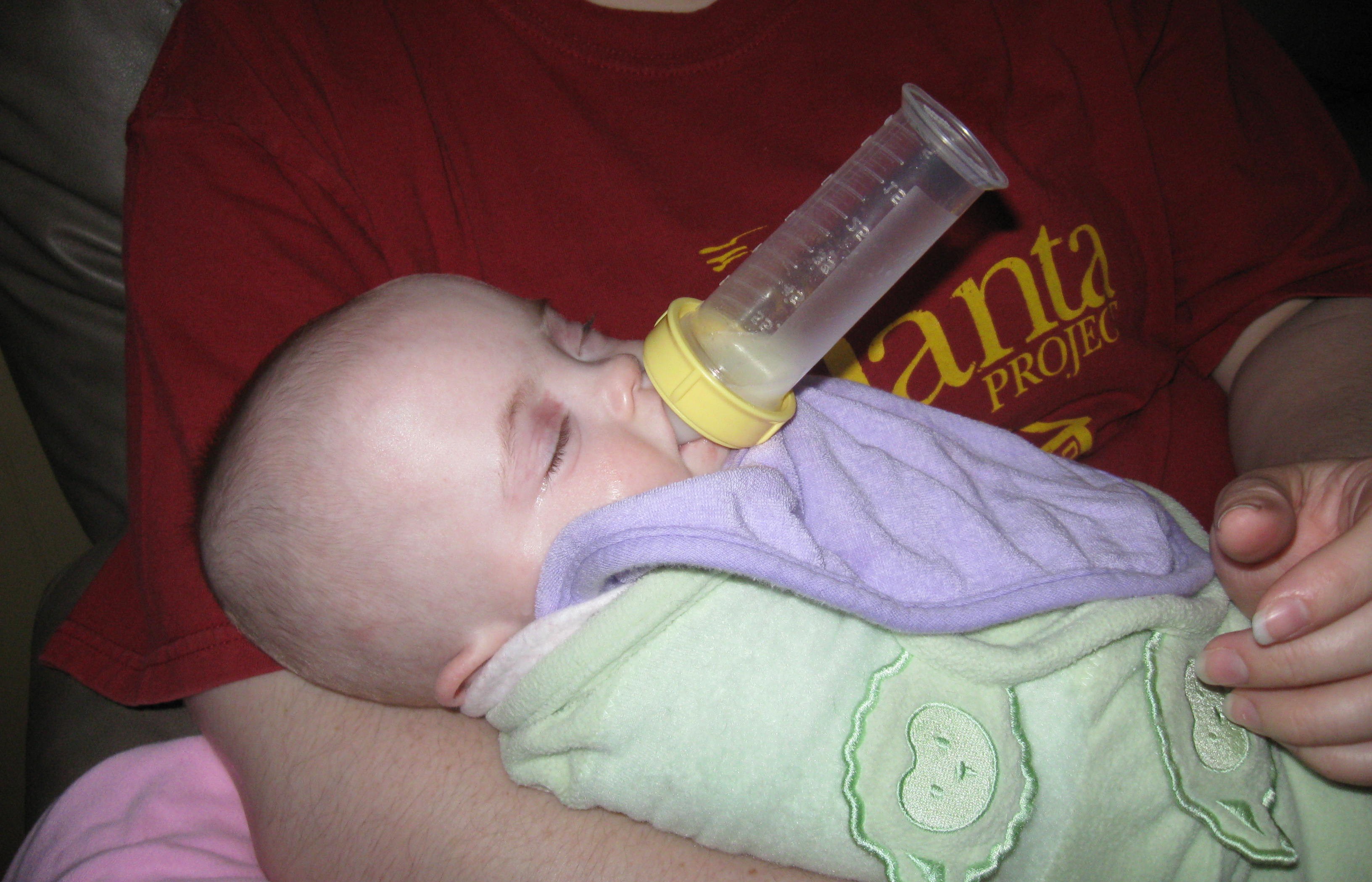 Becca holding her bottle all by herself - without ANY hands.